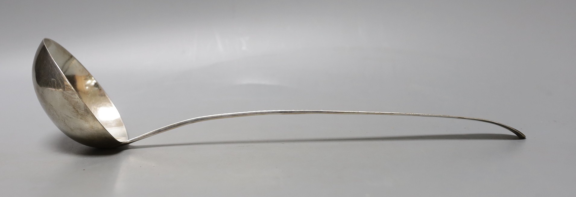 A George III Irish silver bright cut engraved soup ladle, Law & Bayly, Dublin, 1794, 37cm, 191 grams.